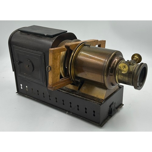 963 - A magic lantern slide projector with electric conversion  together with a wood and brass adjustable ... 