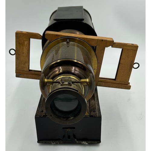 963 - A magic lantern slide projector with electric conversion  together with a wood and brass adjustable ... 