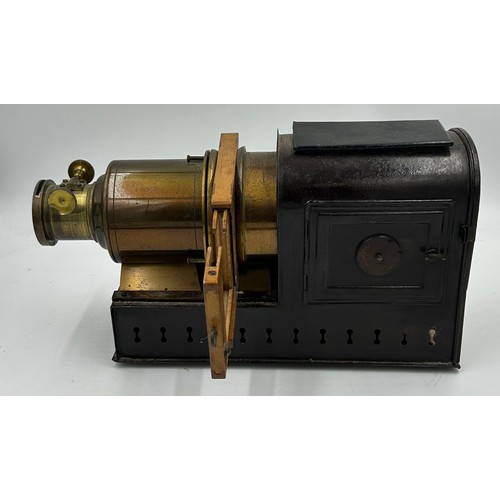 963 - A magic lantern slide projector with electric conversion  together with a wood and brass adjustable ... 