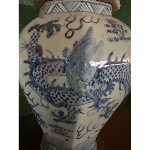 936 - A pair of large blue and white vases with covers, the bodies  decorated with dragons and flaming pea... 