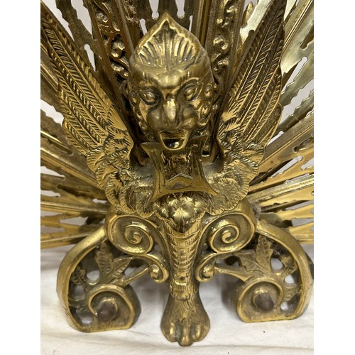 1190 - A vintage brass folding fan shaped fire guard, of peacock form, 63cm high x 95cm w extended together... 