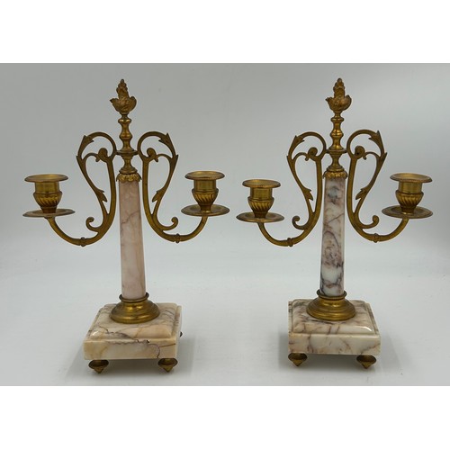 1192 - A pair of French 20thC gilt bronze 3 branch candelabras with winged figural columns and flame finial... 