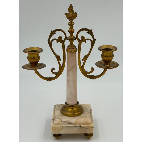 1192 - A pair of French 20thC gilt bronze 3 branch candelabras with winged figural columns and flame finial... 