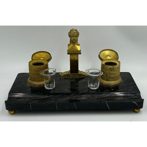 1196 - A Marble and Brass Twin Inkwell Stand with glass inserts and hinged lids and a female bust in the ce... 