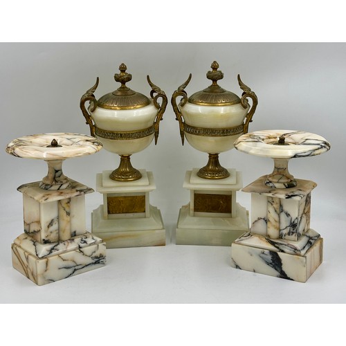 1200 - A pair of French stone garniture urns with twin handles and class plaques to the front, measuring 33... 