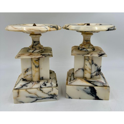 1200 - A pair of French stone garniture urns with twin handles and class plaques to the front, measuring 33... 