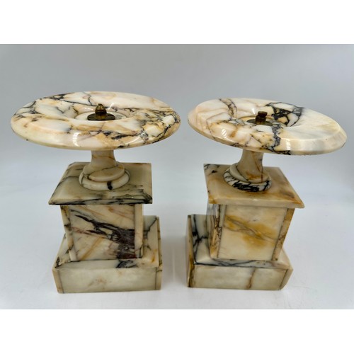 1200 - A pair of French stone garniture urns with twin handles and class plaques to the front, measuring 33... 