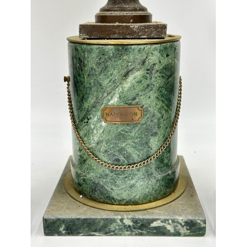 1201 - A metal bust of Napoleon on a marble pedestal 40cm high. Together with a pair of decorative marble o... 