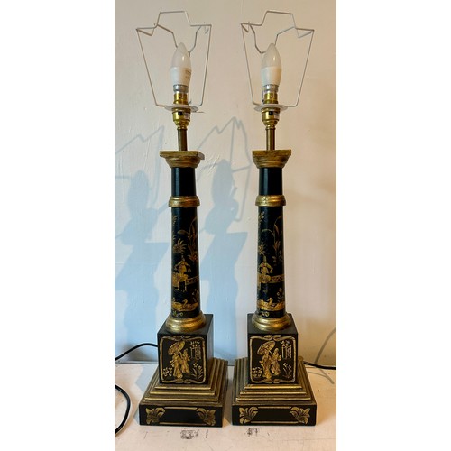 1202 - A pair of contemporary table lamps, painted black metal with gold oriental embellishments. Measures ... 