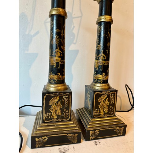 1202 - A pair of contemporary table lamps, painted black metal with gold oriental embellishments. Measures ... 