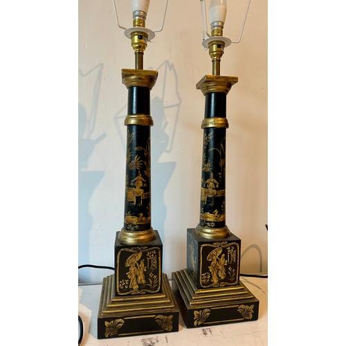 1202 - A pair of contemporary table lamps, painted black metal with gold oriental embellishments. Measures ... 