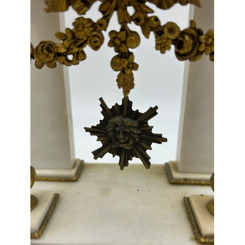 990 - A French Empire style white marble mantel clock decorated with garlands and ribbons. Movement marked... 