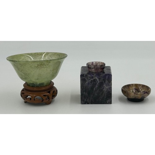 1210 - A Chinese small jade bowl on a wooden stand, 9.8cm diameter, height 4.8cm (excluding stand) together... 