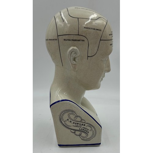 402 - A porcelain L N Fowler phrenology head. 29cm h.