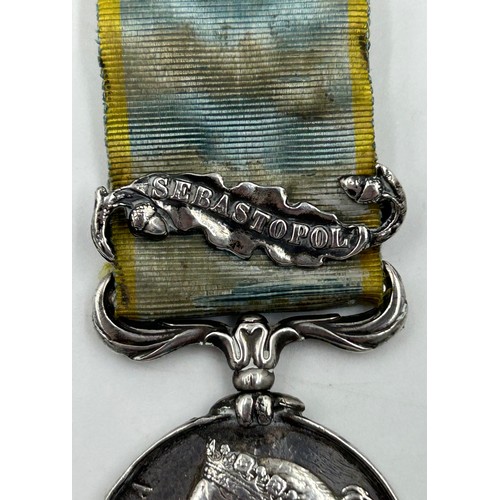 1007 - Crimea War Medal (1854-56) with Sebastopol clasp, name illegible engraved on the edge and some fadin... 