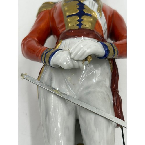 403 - A collection of four Dresden Soldier figurines to include Officer of Royal Artillery Horse Brigade, ... 