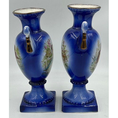 413 - A Staffordshire jardinière/planter and a pair of cobalt blue twin handled vases measuring 31cm high.