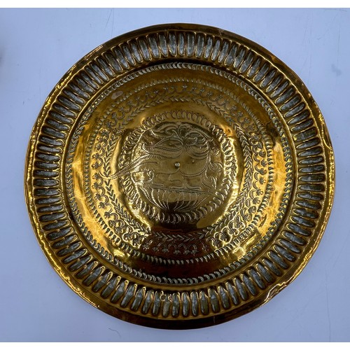 910 - A selection of brass items to include a round dish with bird design in the centre 26cm, cigarette bo... 