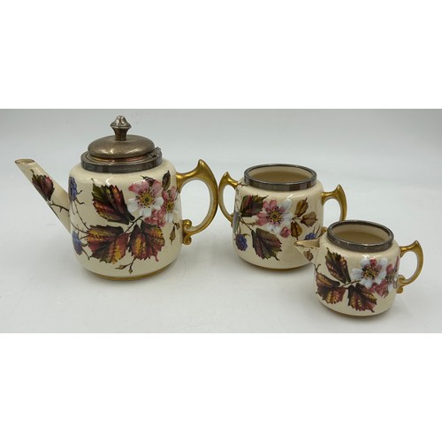 480 - A Taylor Tunniciffe & Co ceramic teapot, sugar bowl and milk jug in floral design with silver rims m... 