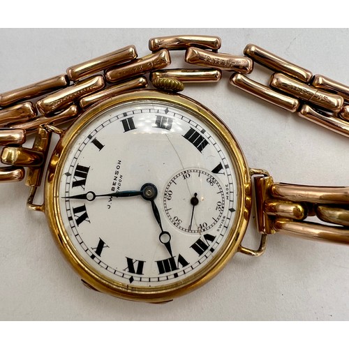 711 - A 9 carat gold wristwatch with subsidiary seconds dial, marked JW Benson London on a 9 carat gold ex... 