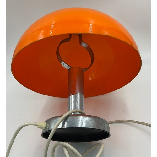 974 - A 1960s Pop Art orange and chrome table lamp, perspex shade and chrome stand. 31cm h.