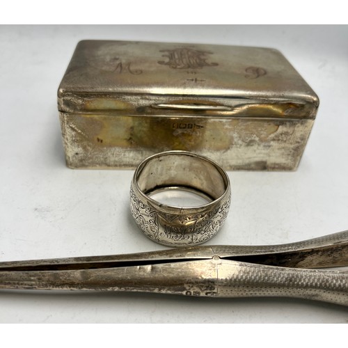 820 - Hallmarked silver to include cigarette box, napkin ring and glove stretchers. Various dates and make... 