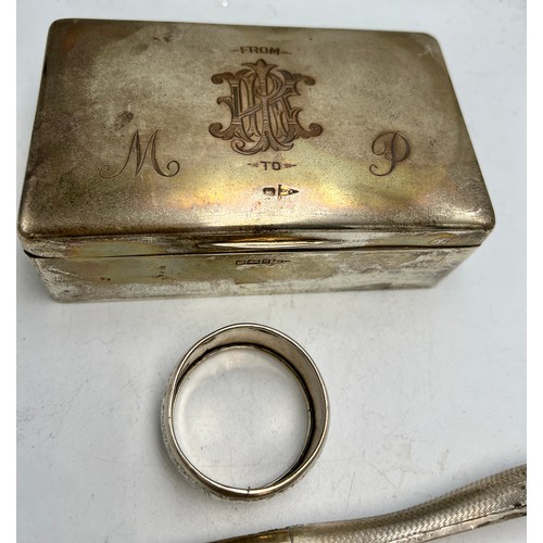 820 - Hallmarked silver to include cigarette box, napkin ring and glove stretchers. Various dates and make... 