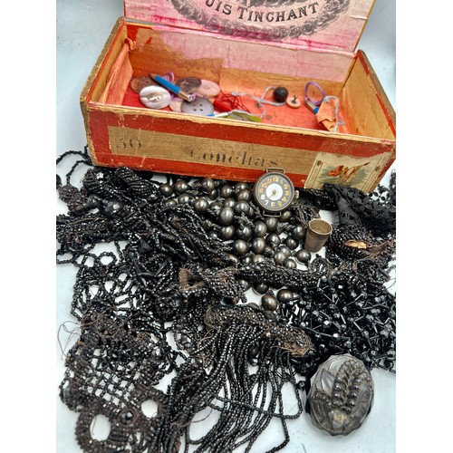 1223 - A cigar box and contents to include jet brooch, french jet beadwork dress trimmings, 925 silver watc... 