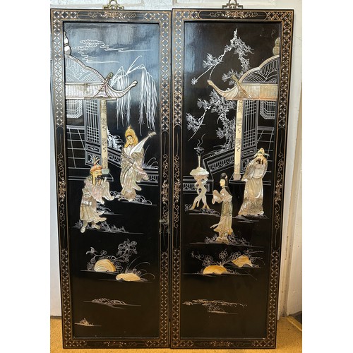 1224 - A pair of 20thC decorative wall panels depicting oriental scenes with mother of pearl embellishment ... 