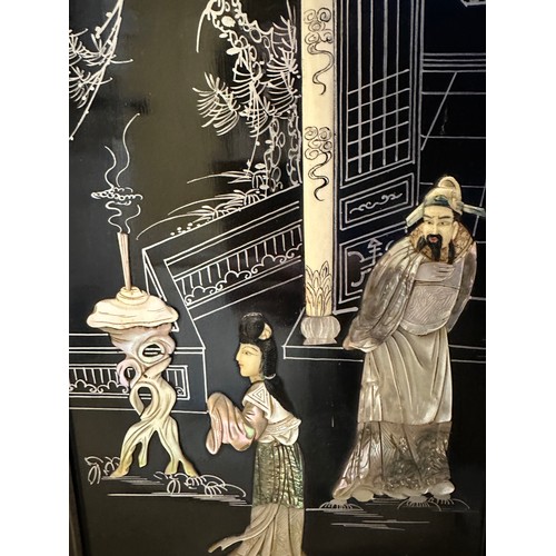 1224 - A pair of 20thC decorative wall panels depicting oriental scenes with mother of pearl embellishment ... 