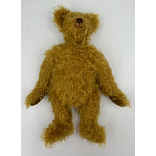 1114 - A vintage Mohair Growling Teddy with movable head, joints, velvet feet, stitched nose and black glas... 