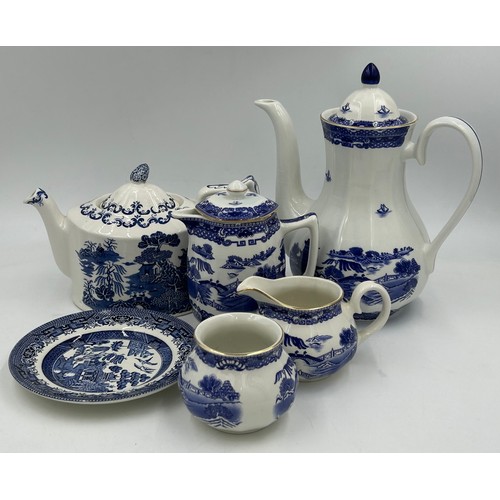 427 - A large quantity of Ringtons Tea china to include willow pattern coffee pot, teapot, jug with lid, s... 