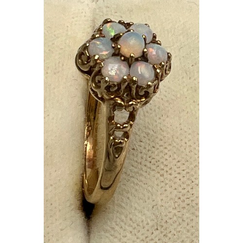 592 - A 9 carat gold opal cluster ring. Size P. Weight 2gm.