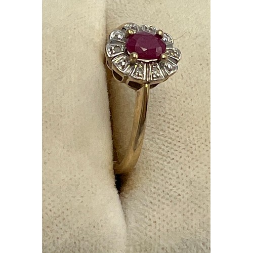 597 - A nine carat gold cluster ring set with pink and clear stones. Size L/M. Weight 1.9gm.