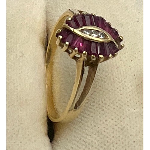 602 - A ruby and cubic zirconia ring set in 14 carat yellow gold. Size N. Weight 1.9gm.