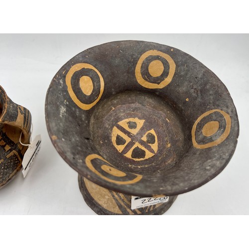 943 - Three Chinese Neolithic vessels to include a flared tazza, a single handled cup and twin handled bow... 