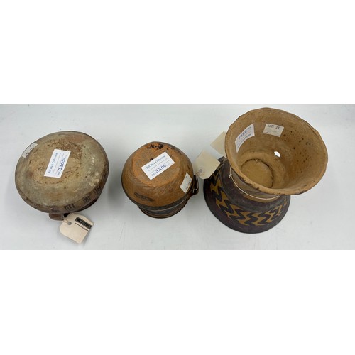 943 - Three Chinese Neolithic vessels to include a flared tazza, a single handled cup and twin handled bow... 