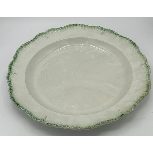 144 - An early 19th century pearlware green shell edge charger, c. 1810. 34cm (1)

Condition: Minor fritti... 