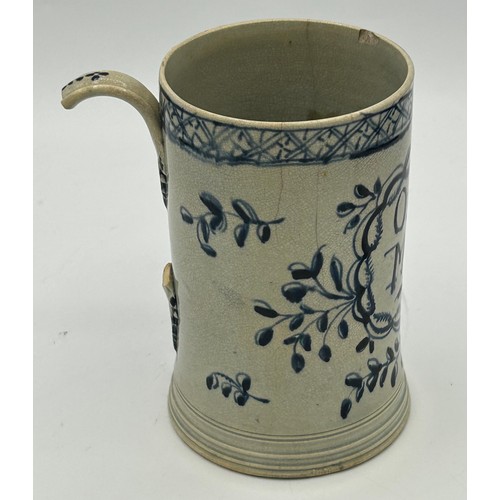 147 - An 18th century blue and white hand-painted pearlware dated mug, c. 1769. With 