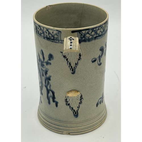 147 - An 18th century blue and white hand-painted pearlware dated mug, c. 1769. With 