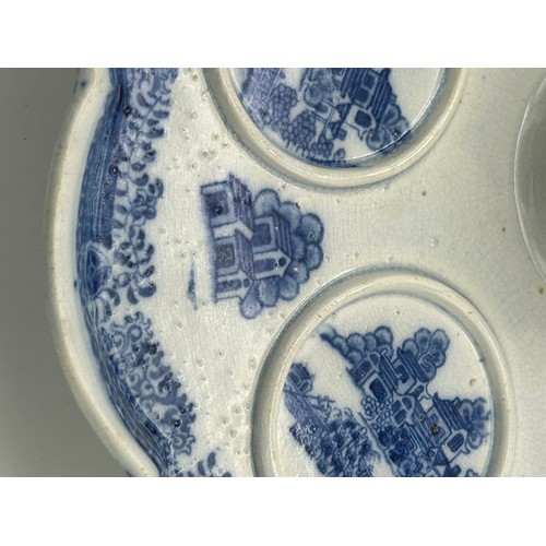 160 - An early 19th century blue and white transfer printed Spode Forest Landscape pattern custard cup sta... 