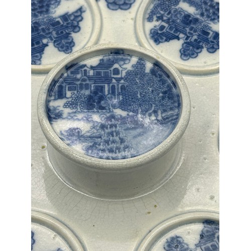 160 - An early 19th century blue and white transfer printed Spode Forest Landscape pattern custard cup sta... 