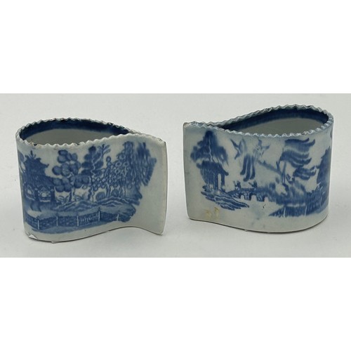 168 - Two early 19th century pearlware blue and white transfer printed willow pattern comma cups, c. 1810.... 