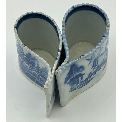 168 - Two early 19th century pearlware blue and white transfer printed willow pattern comma cups, c. 1810.... 