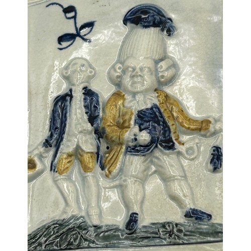 172 - Two early 19th century pearlware moulded tea caddies, c. 1810. One decorated with figures and the ot... 