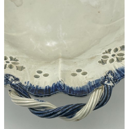 176 - An early 19th century hand-painted pearlware blue and white shell edge footed comport with rope-twis... 