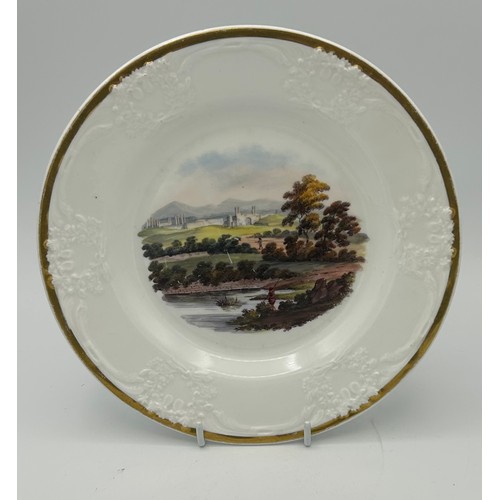 184 - A group of early 19th century hand-painted porcelain plates, of moulded form with titled Indian view... 