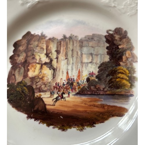 184 - A group of early 19th century hand-painted porcelain plates, of moulded form with titled Indian view... 