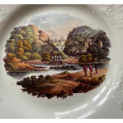 184 - A group of early 19th century hand-painted porcelain plates, of moulded form with titled Indian view... 