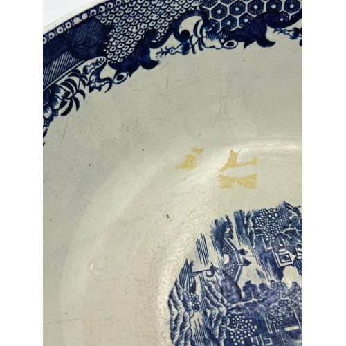 192 - A group of early 19th century blue and white transfer printed Conversation pattern bowls, c. 1800. 2... 